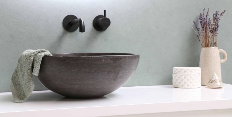 grey stone bathroom sink and black tapware-min