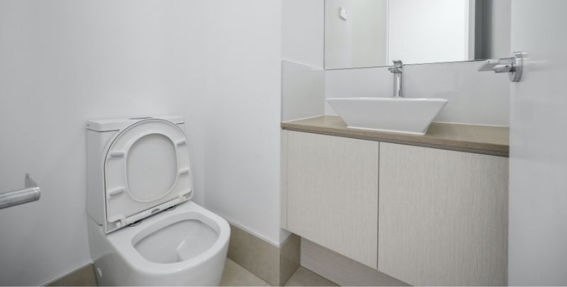 white bathroom with toilet and sink