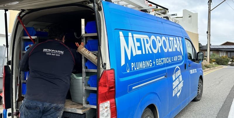 Plumber getting tools from Metropolitan van