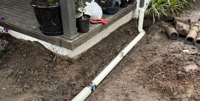 outdoor leaking pipe coming from the gutters of the house