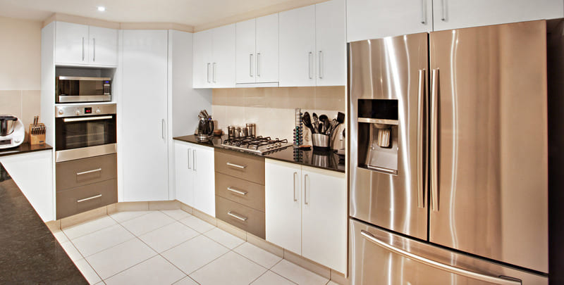 kitchen setting featuring a fridge with an ice and water dispenser